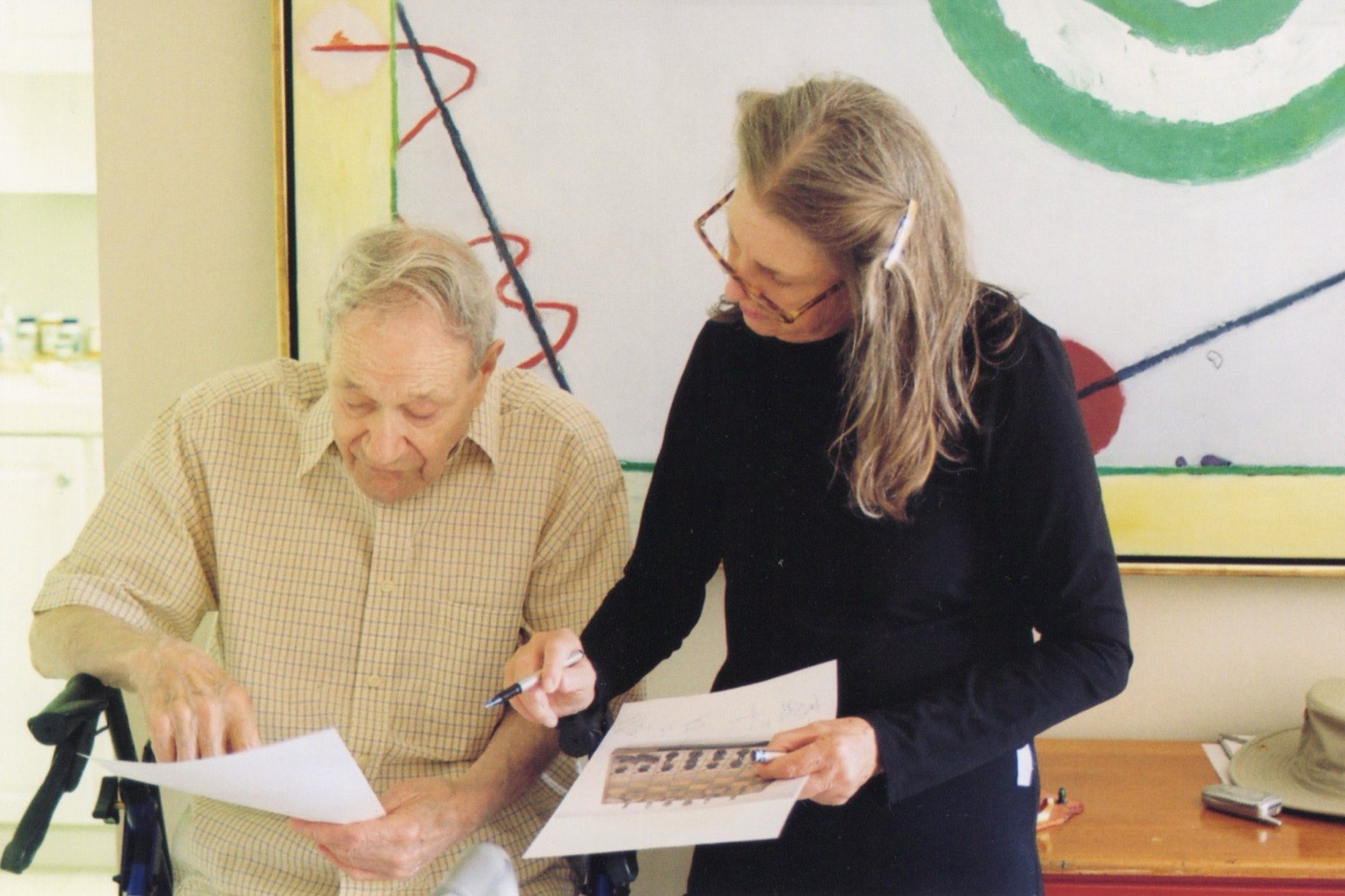 Frank Lobdell reviewing works on paper in his studio with his wife Jinx