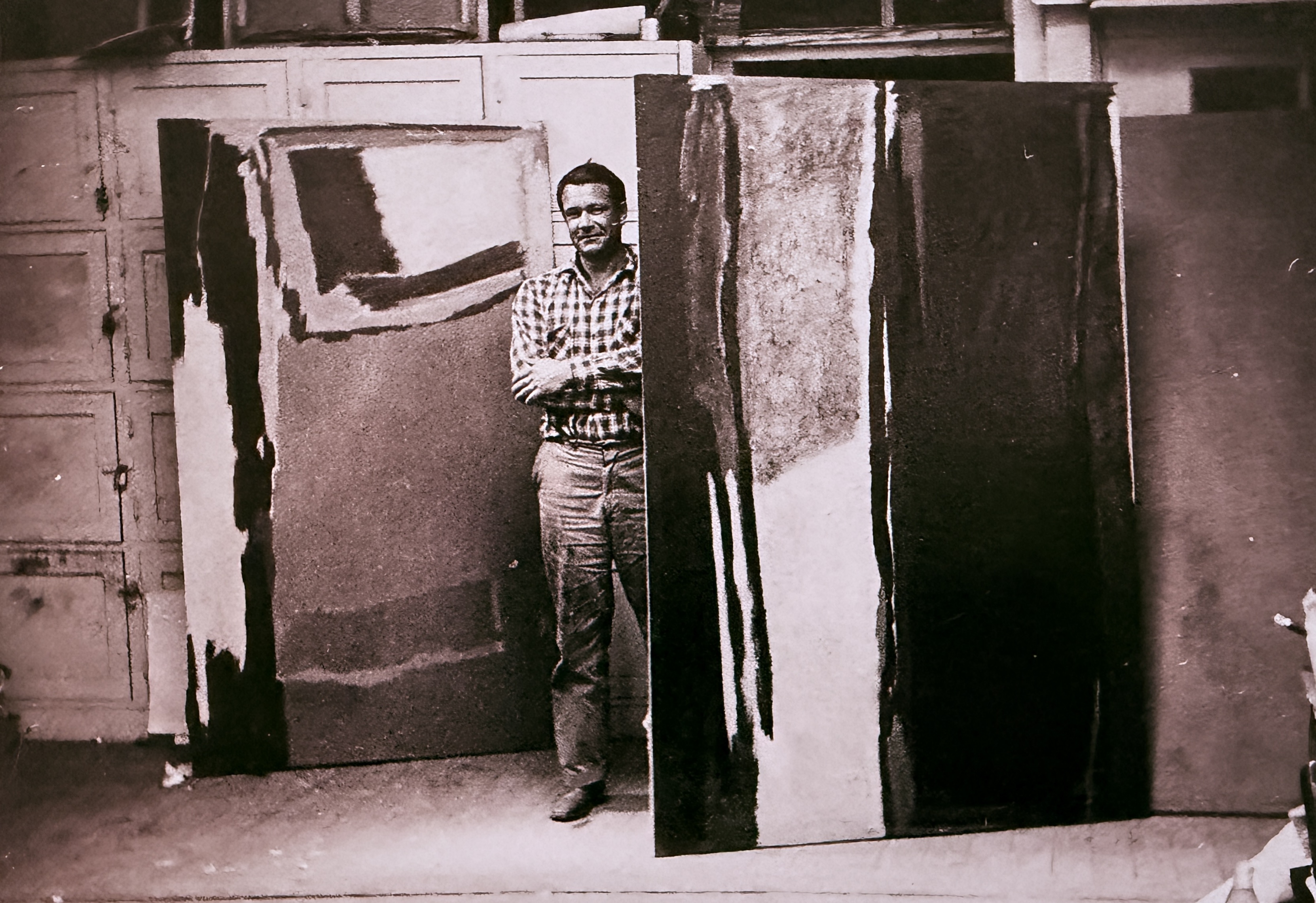 Frank Lobdell among his dark canvases in the studio